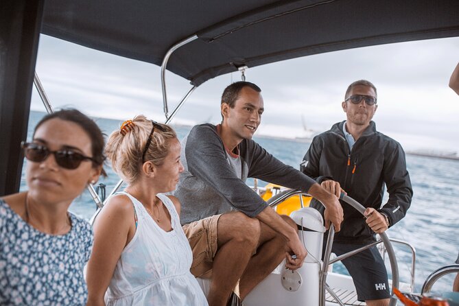 Barcelona 1-hour Boat Trip with Cava and Snacks - Sergio at the helm: what a real skipper experience feels like