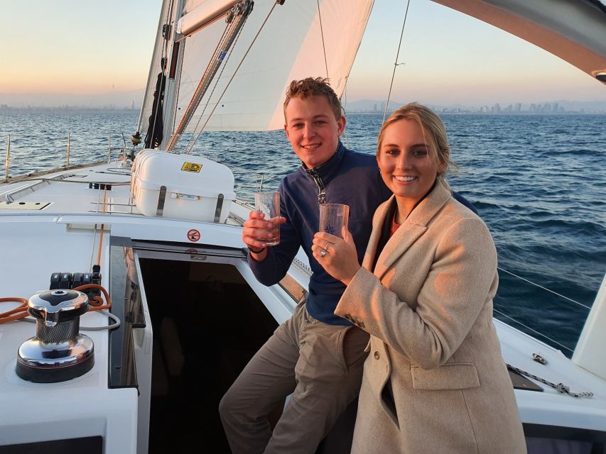 Barcelona: 2-Hour Sailboat Tour with Snacks and Drinks - Leaving Port Vell: yachts, Maremagnum, Columbus, and harbor architecture