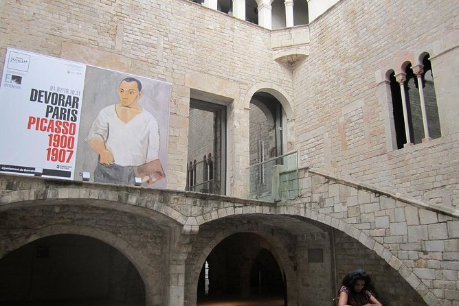 Barcelona Art and Tapas Small Group Walking Tour with Picasso Museum - Starting at Plaça Reial, royal name, Gaudí lamp posts, and a full-on food mood
