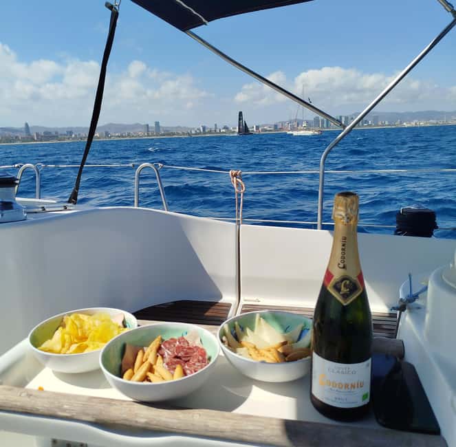 Barcelona Badalona : Sailboat Tour, Snacks, Drinks, Swimming - The 2-Hour Flow: Aperitif, Skyline, SUP, and a Swim Break