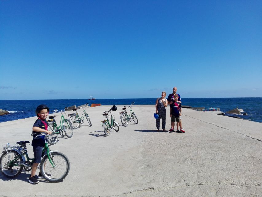 Barcelona: Bike Tour for Families - Barceloneta beach and the waterfront return, where the city slows down