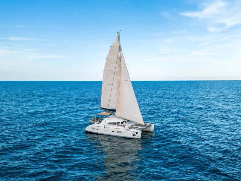 Barcelona: Catamaran Cruise w/ Sailing, Wine, & Tapa - Wine and tapa service on a moving catamaran