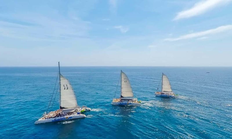 Barcelona: Catamaran Party Cruise with BBQ Meal - Sailing along the Barcelona coast toward Badalona