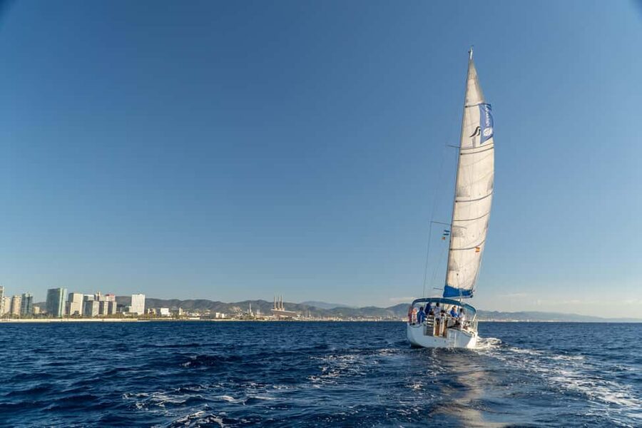 Barcelona: Coastline Sailing with Swim Toys w/ Food & Drinks - The 2-hour secret stop: swimming, snorkeling, and stand-up paddle boarding