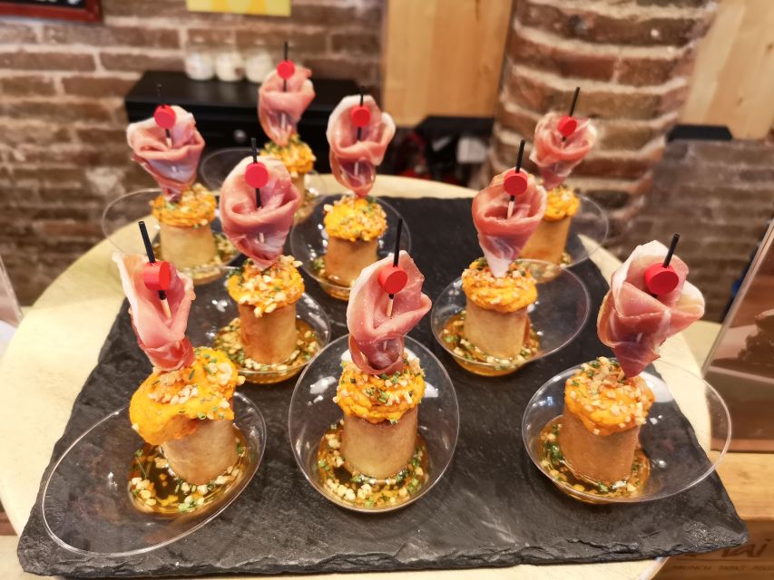 Barcelona: Food & Drink Tasting Tour in Traditional Taverns - Raval flavor walk: tapas and the dishes you should know