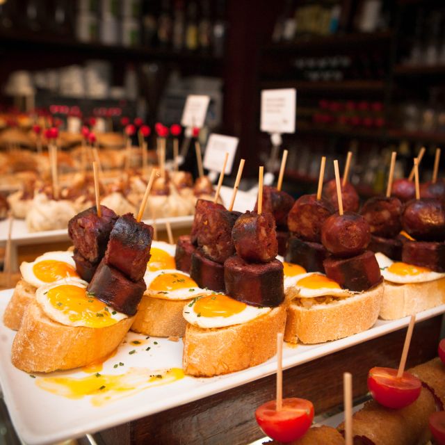 Barcelona: Food & Drink Tasting Tour in Traditional Taverns - La Boqueria Market with ham tasting: what to expect and what to watch