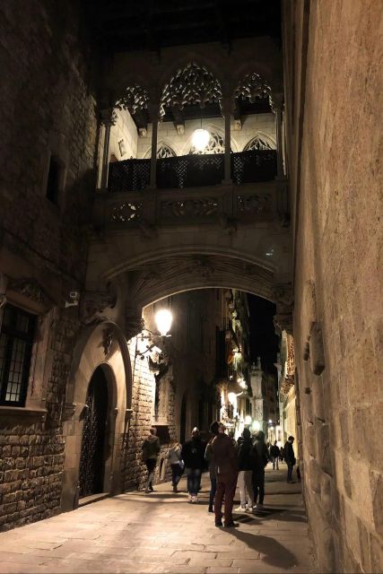 Barcelona: Gothic Quarter By Night Guided Walking Tour - Roman cemetery to Roman walls, how ancient Barcelona still shows up