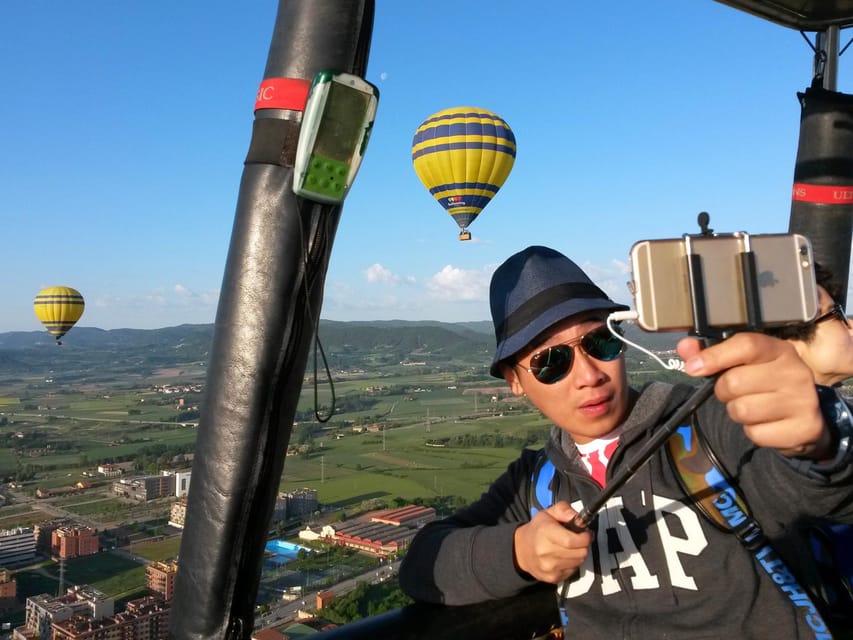 Barcelona: Hot Air Balloon Ride with Optional Transportation - After landing at the field: pink Cava, brunch, and a pilot-signed certificate