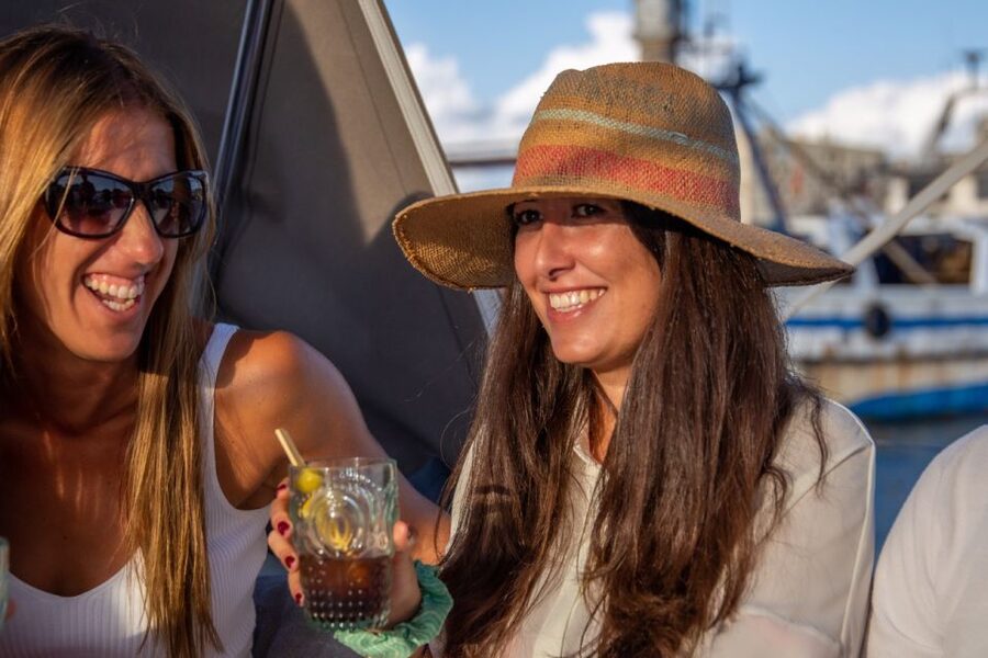 Barcelona: Local Tapas and Drinks Sailing Adventure Tour - Boarding and the vibe on a small boat