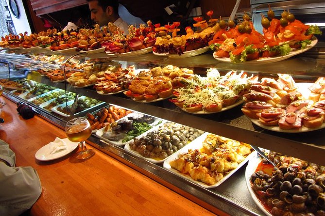 Barcelona Old Town Night Small Group Tour with Tapas & Flamenco - Las Ramblas tapas stop: learn the menu before you order