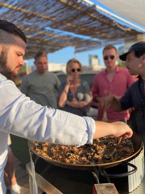 Barcelona: Rooftop Paella Cooking Class with Sangria - Cooking seafood paella from scratch: sofrito, broth, and rice technique