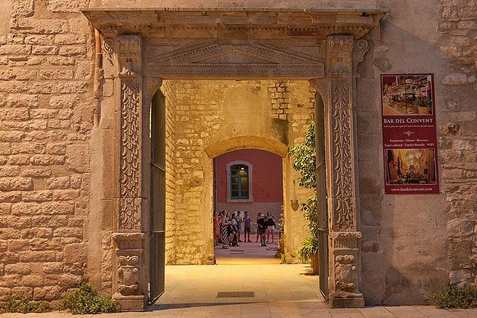 Barcelona's Dark History Night Tour - Barcelona at twilight, where inquisition stories hit closer