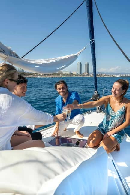 Barcelona: Sailing Tour with Young Local Captain & Drinks - Stop by Port Vell: the marina-to-city moment