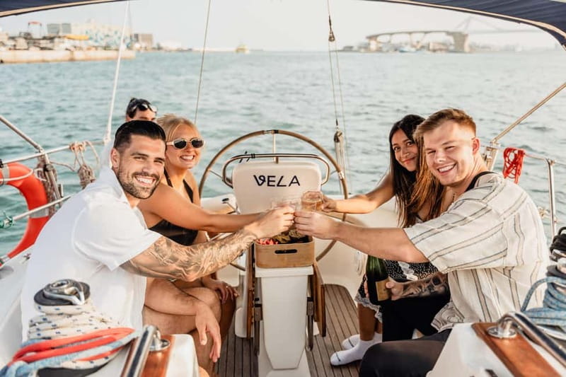 Barcelona: Sailing Tour with Young Local Captain & Drinks - The view point break: wine, photos, and swim time