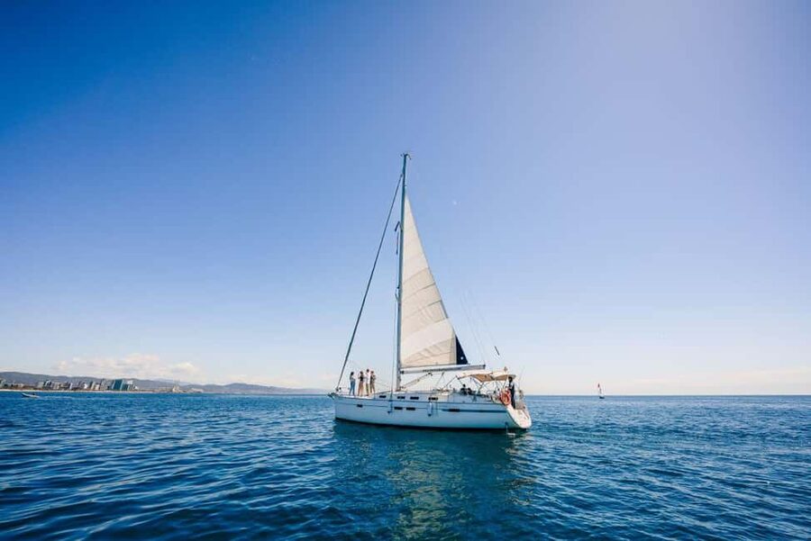 Barcelona: Sailing trip with GINTONIC workshop - Setting sail near the Barcelona coast during golden hour