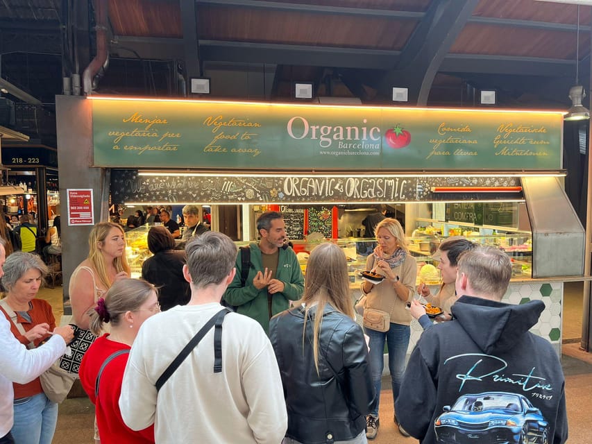Barcelona: Street Food & Sightseeing Tour with Local Market - Entering La Boqueria, the market that feeds half the city’s snack habits