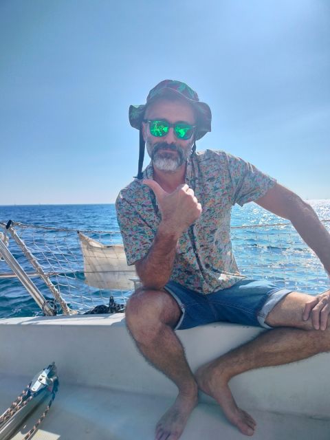 Barcelona: Sunset Cruise with Snacks and Drinks - Snacks, drinks, music, and the comfort win at the bow