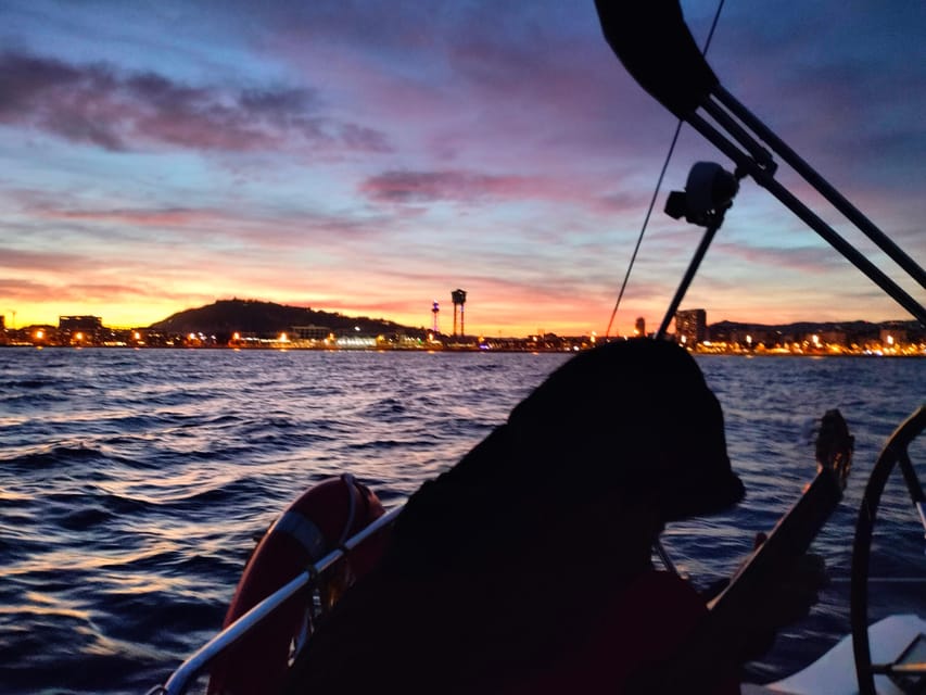 Barcelona: Sunset Cruise with Snacks and Drinks - Sunset timing and the nighttime skyline pass