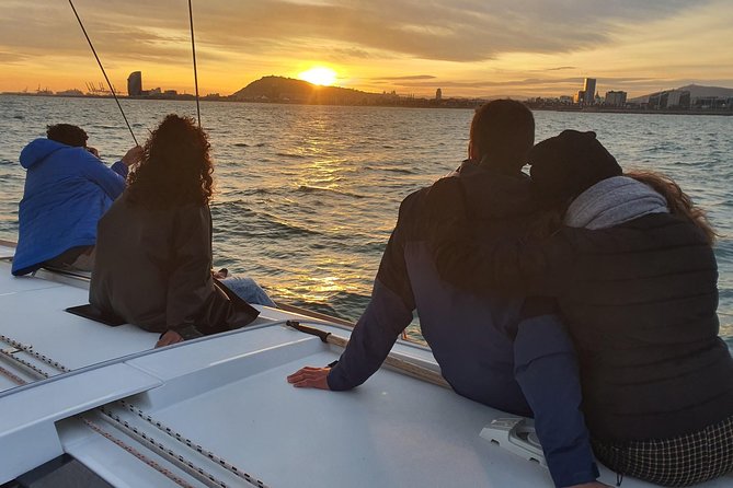 Barcelona Sunset Sailing Cruise from Port Olímpic with Open Bar - Hoisting sails toward the skyline (when the wind cooperates)