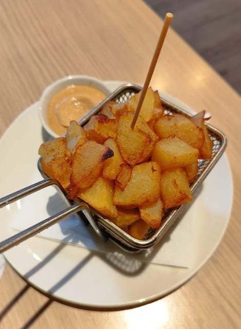 Barcelona: Tapas and Pintxos Tour with Crema Catalana - Pintxos explained, and what to look for at the counter