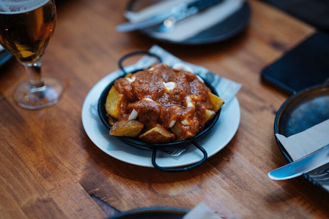 Barcelona Tapas Food Walking Tour with Wine in El Born - Carrer Ample in the Gothic Quarter: Croquettes, Bravas, and Pimientos de Padrón