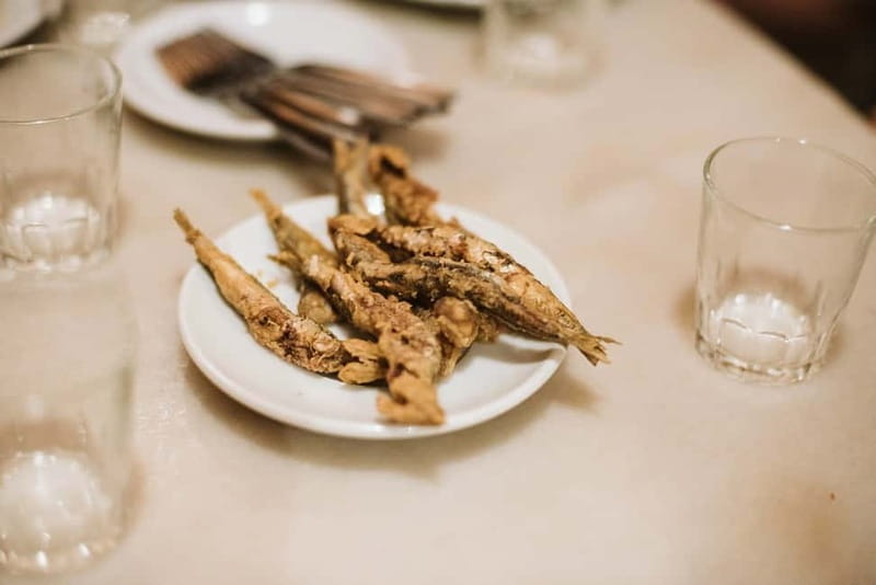Barcelona: Tapas, Wine & History Tour of the Old Town - The sit-down finale: shared plates with red wine and Spanish dessert