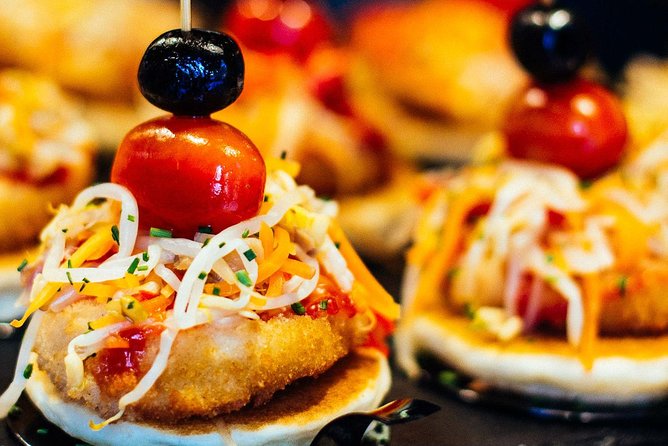 Barcelona With Locals: Wine and Tapas Private Tour - Stop 1: Mercat de Sant Antoni, what to watch for