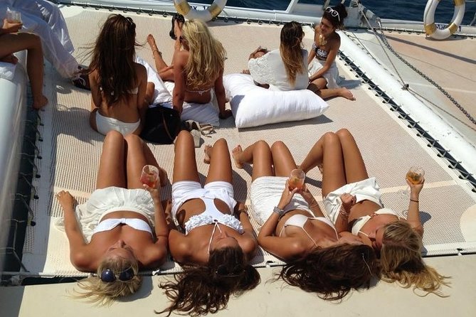 Catamaran trip with other groups along the Costa Brava. Saturday. - Coves, Trampoline, and Seabed Viewing: What the Anchor Stop Gives You