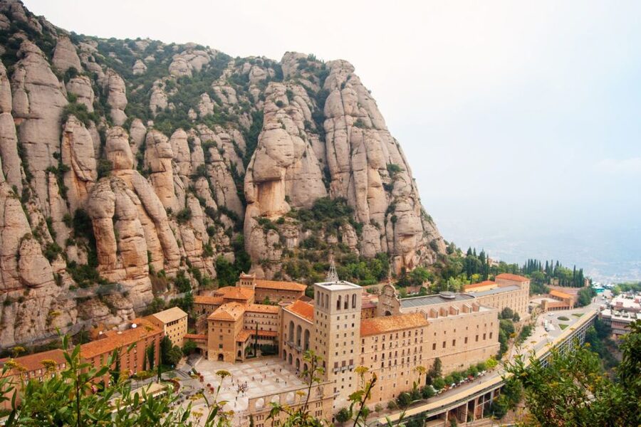 From Barcelona: Montserrat Tour, Rack Railway & Licor Taste - Monistrol de Montserrat: a short guided grounding stop