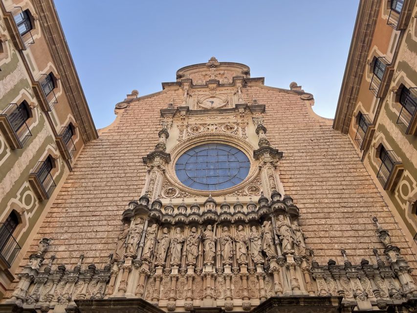 From Barcelona: Private Montserrat and Boutique Winery Tour - Inside Montserrat: Basilica entrances and the black Madonna legend