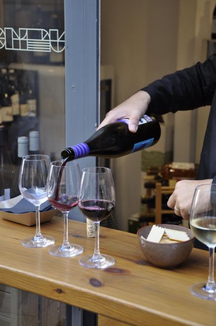 Girona Evening Food Tour & Tapas Bar Experience - Plaça de Catalunya tasting and the Casa Cacao sugar window