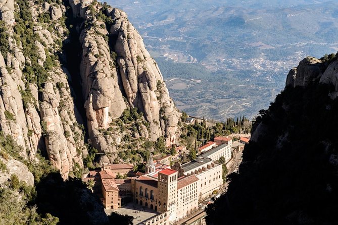 Montserrat Lunch & Wine at Farmhouse Small Group from Barcelona - Day trip with mountain views, monastery details, and a real meal