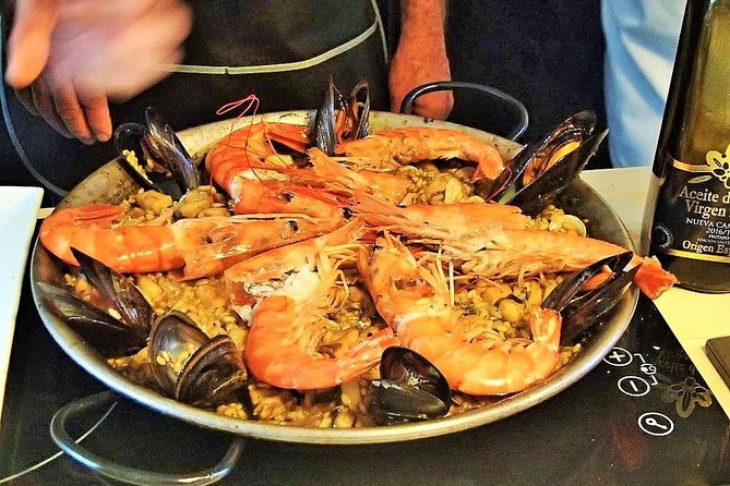 Premium Paella Cooking Class & 10 Spanish Tapas - How paella works for small groups of 11