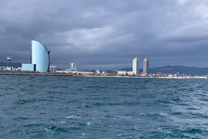 Private sailing and paddlesurfing tour with skipper up to 11 people - Port Olimpic (Stop 1): Olympic Port views and easy seaside energy