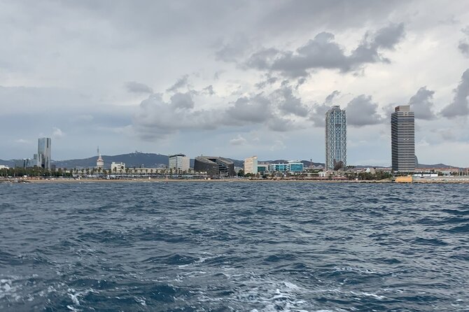 Private sailing and paddlesurfing tour with skipper up to 11 people - Port Vell (Stop 3): Old Port docks and a calmer photo angle