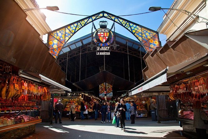 Spanish Oysters, Cava and Ibérico Ham at Barcelona’s La Boqueria Market - The first taste moment: oysters, olives, and jamón de bellota at the market