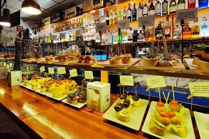Spanish Wine and Tapas Tour in a Local Neighborhood in Barcelona - What you eat and drink: tapas counts, wine pours, and non-alcoholic options
