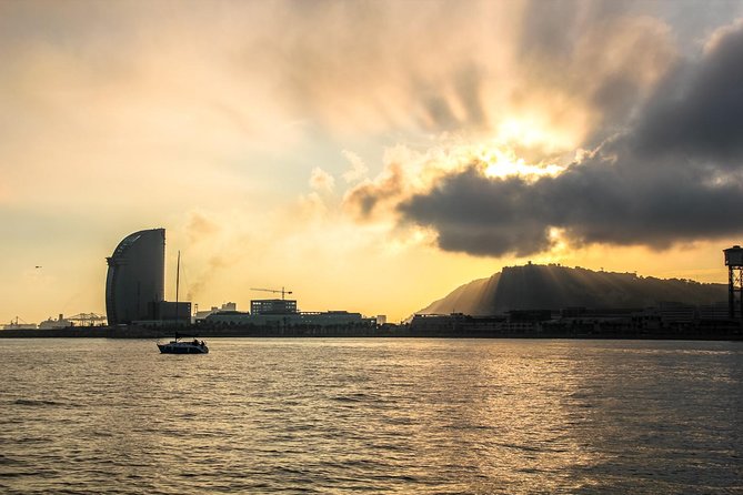 Sunrise Private Sailing Experience from Port Olimpic - Safety gear and skipper style when the wind picks up
