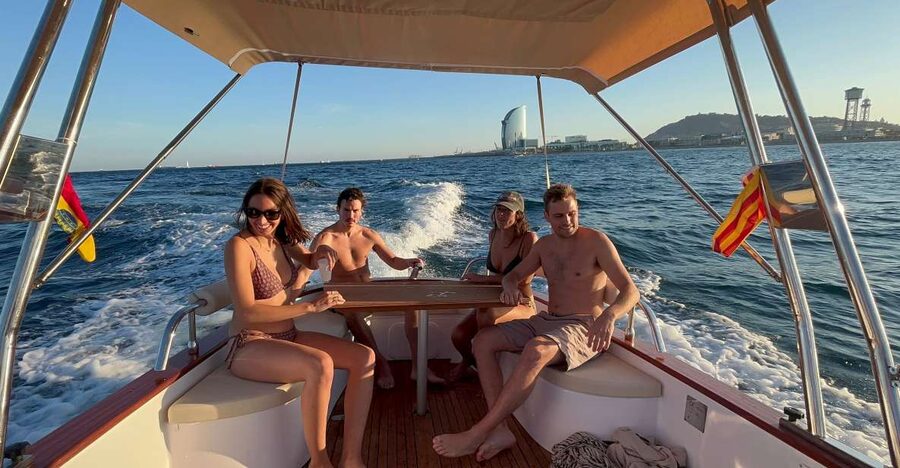 Sunset from a private Classic Yacht - Why a sunset yacht from Port Olimpic works so well