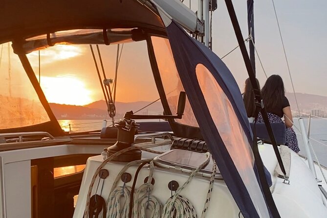 Sunset Sailboat Tour along the Coast with Open Bar - Getting on board: Moll de Mestral and why timing matters