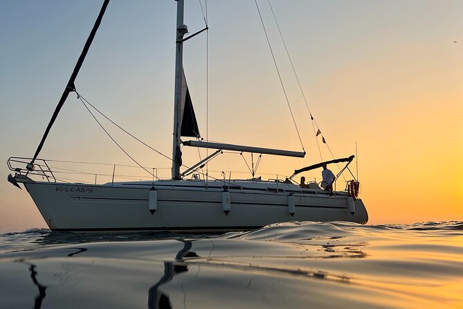 Sunset Sailing Cruise in Barcelona led by Young & Local Captain - On board: the captain vibe, music, and the included tastings
